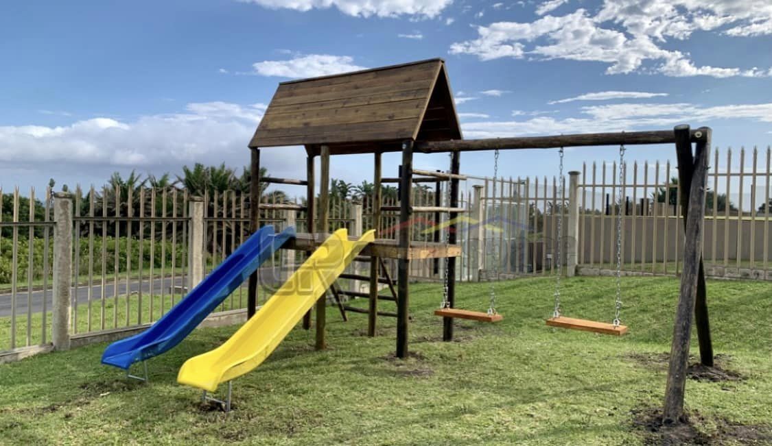 Customised Jungle Gym. Platform with roof, two standard fibre glass slide, two wooden and chain swings