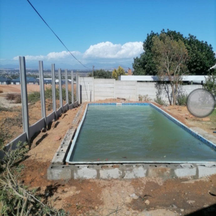 Halfway installing a fibre glass swimming pool in  northern paarl 