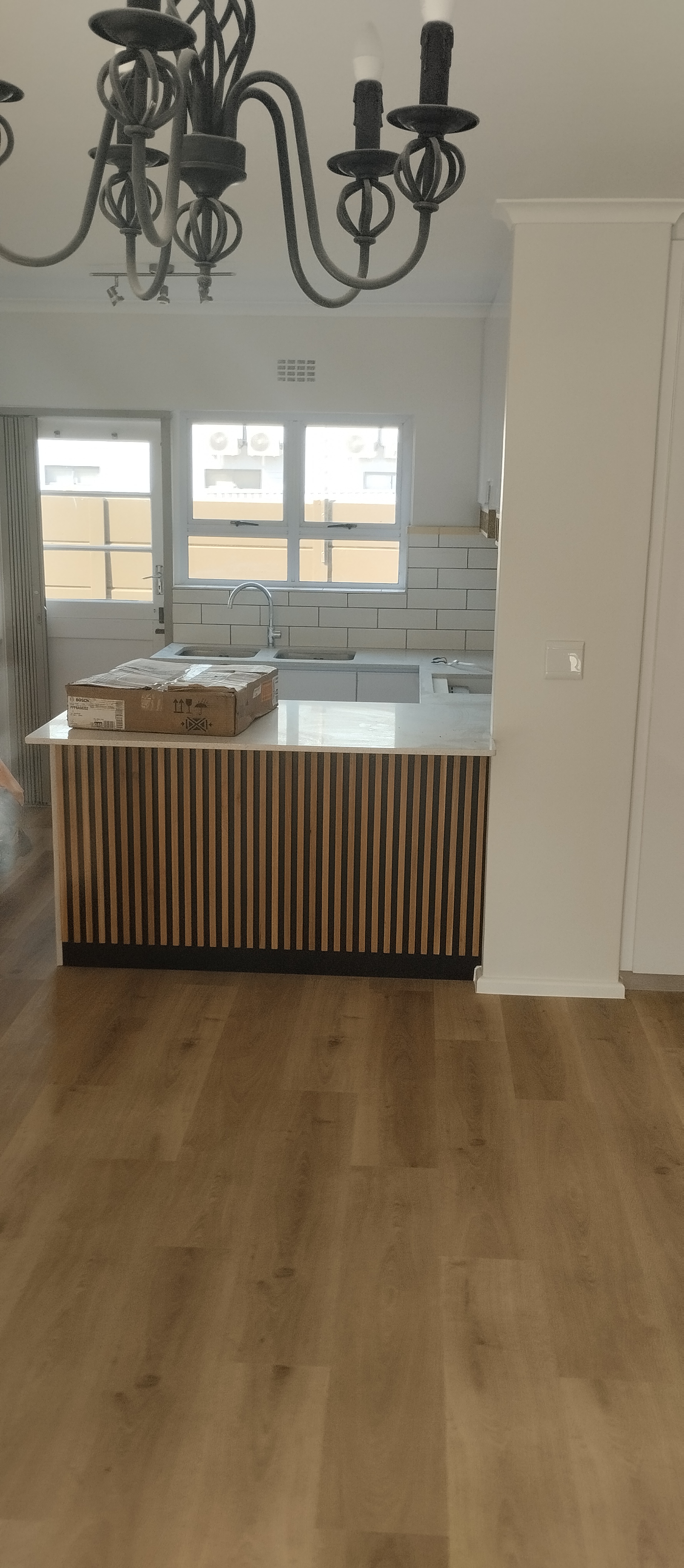 Laminate flooring, kitchen renovation and painting done