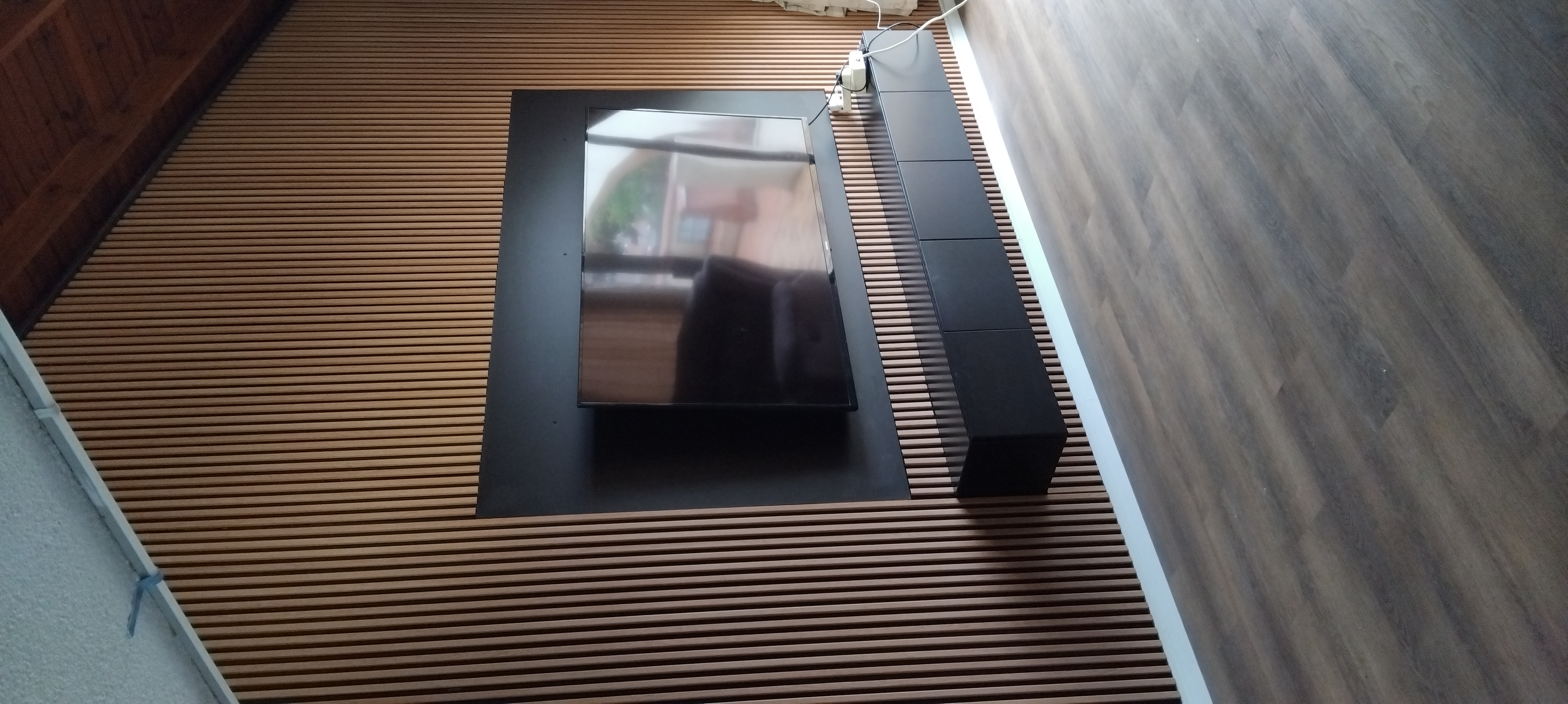 TV unit with wall slats