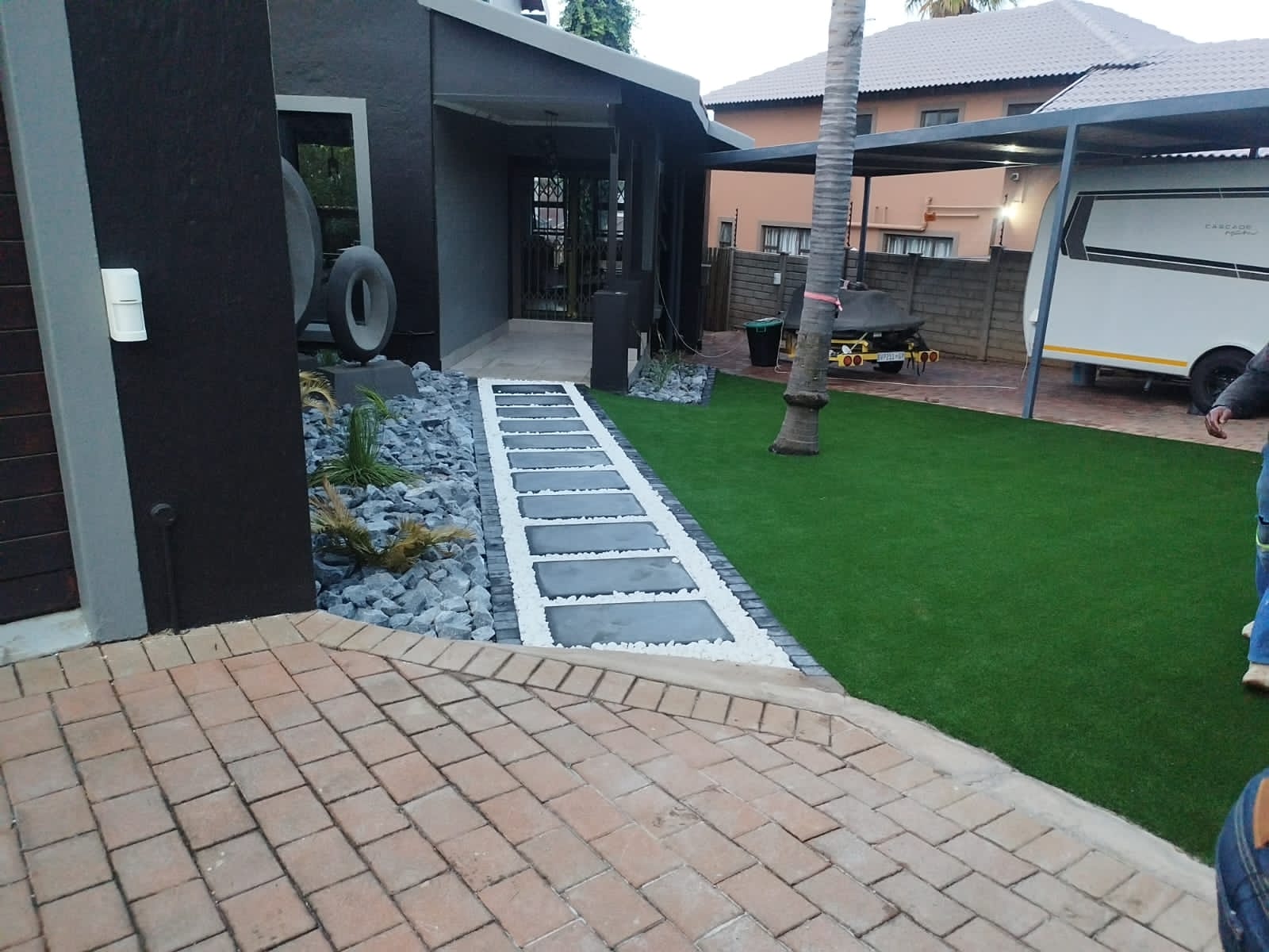 when making this design we used white pables,dump rocks,stepping stones and artificial grass