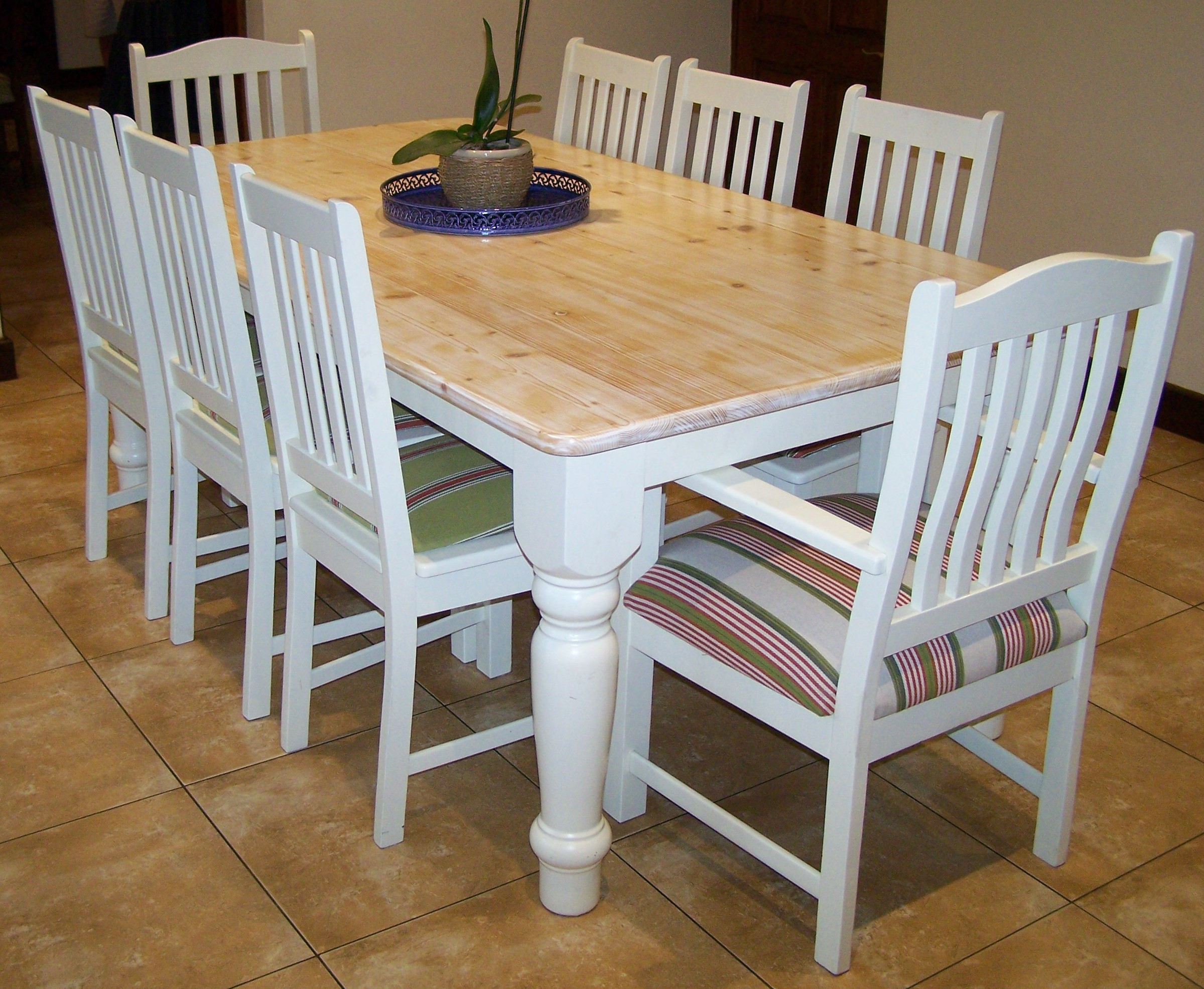 Dining room table and chairs.  Table top is solid.  Chairs upholstered.