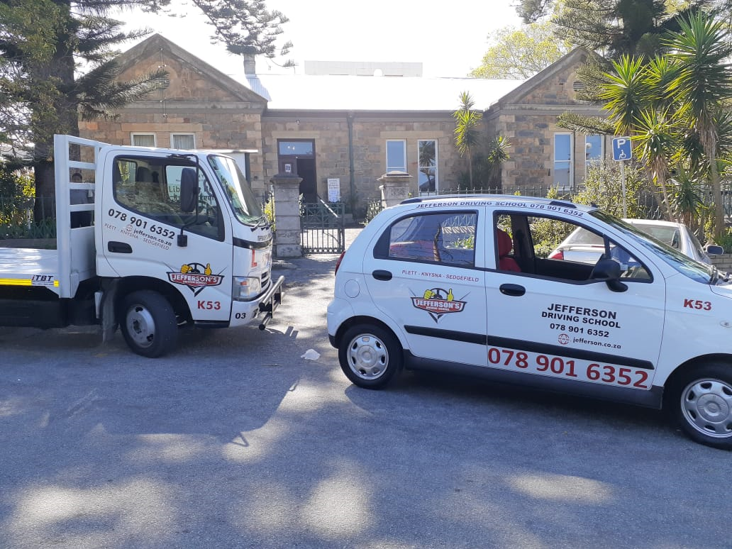 Jefferson Driving School vehiclels on displsy in front of the library just off main road in Knysna.
