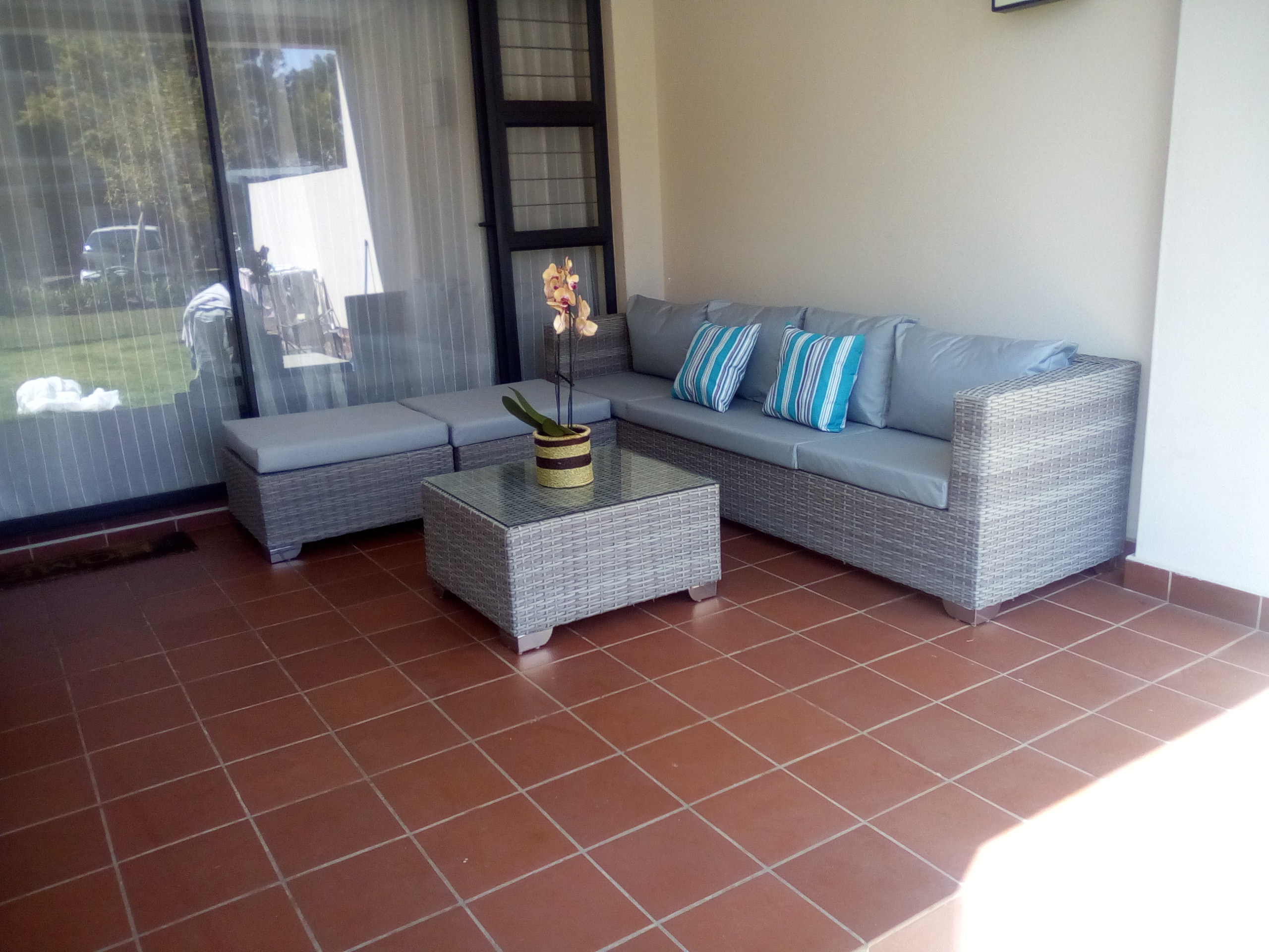 L shape lounge set  with ottomans in kubu grey